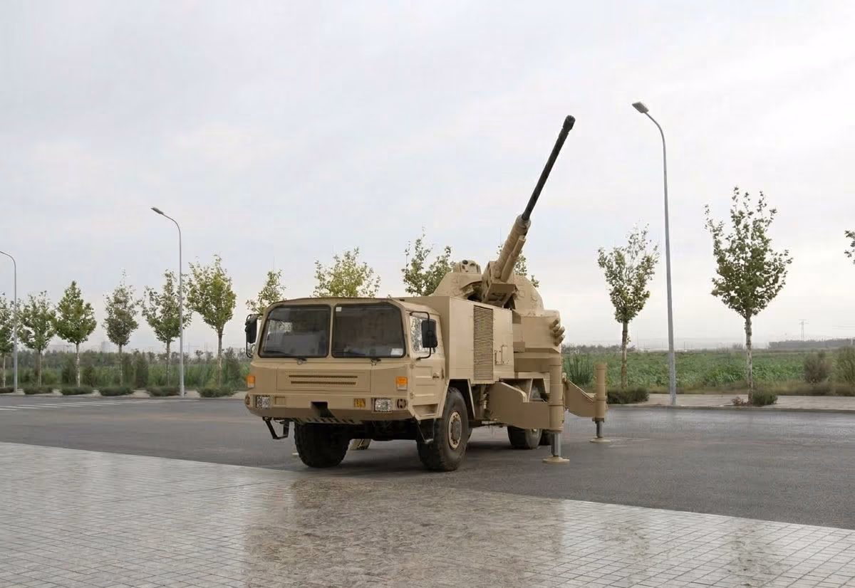 NORINCO LD76 (SA2) 76mm truck-mounted SPAAG with gun elevated, shown in desert tan livery at a static display