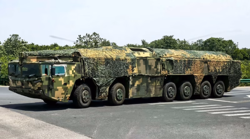 Chinese PLA DF-27 mobile missile launcher under camouflage netting on a road in Hebei Province, April 2026