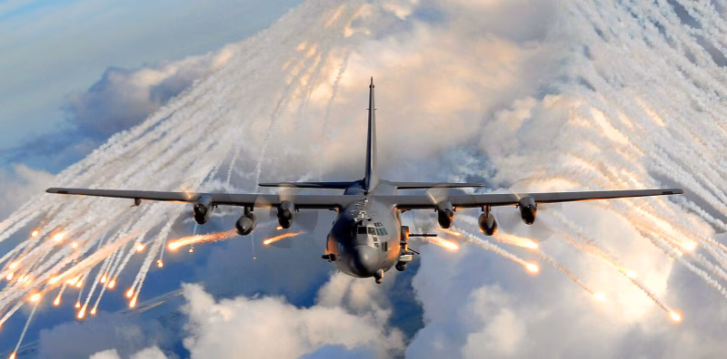 AC-130U Spooky releasing flares in flight