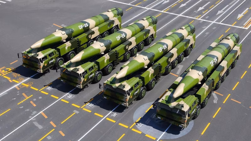 Multiple DF-26 intermediate-range ballistic missiles on transporter-erector-launcher vehicles during a Chinese military parade