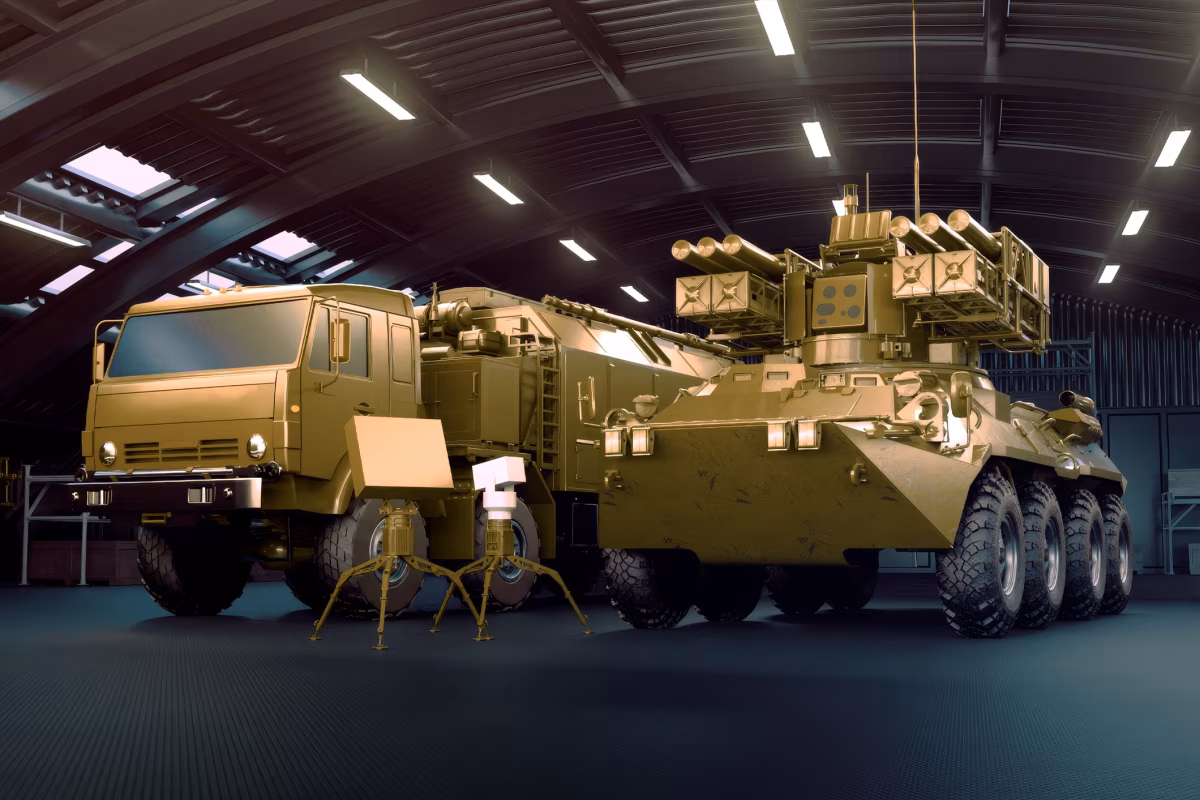 Krona-E system components: BTR-82A combat vehicle with launch turret (right), KamAZ command post (left), and Repeinik detection radar unit (foreground)